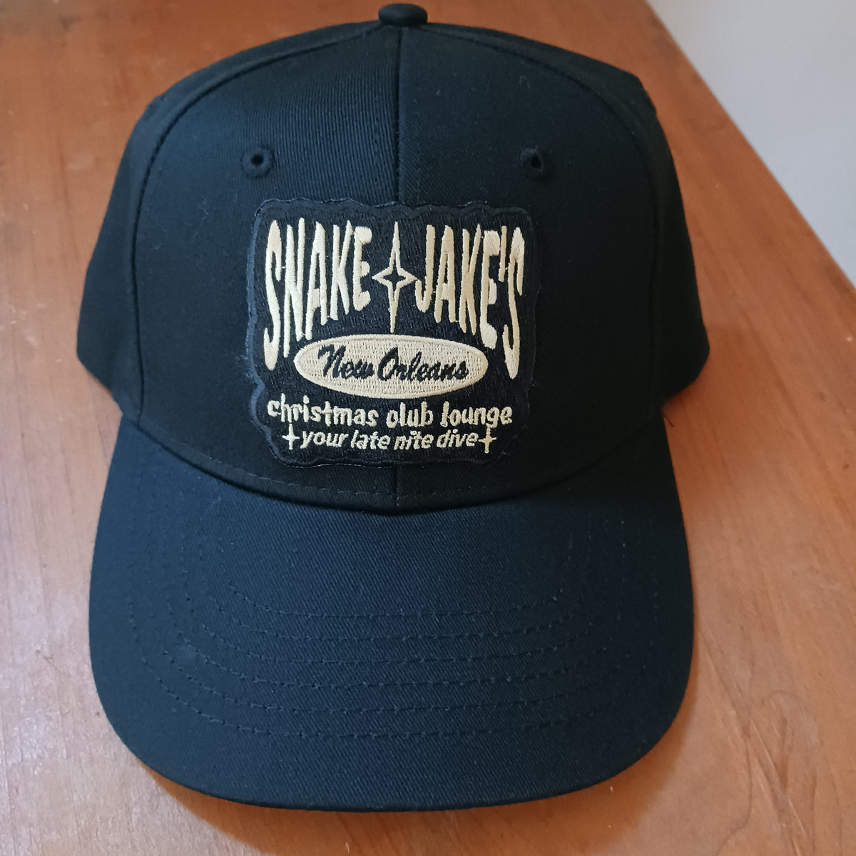 SNAKE & JAKE'S BLACK CAP W/ GOLD LOGO PATCH